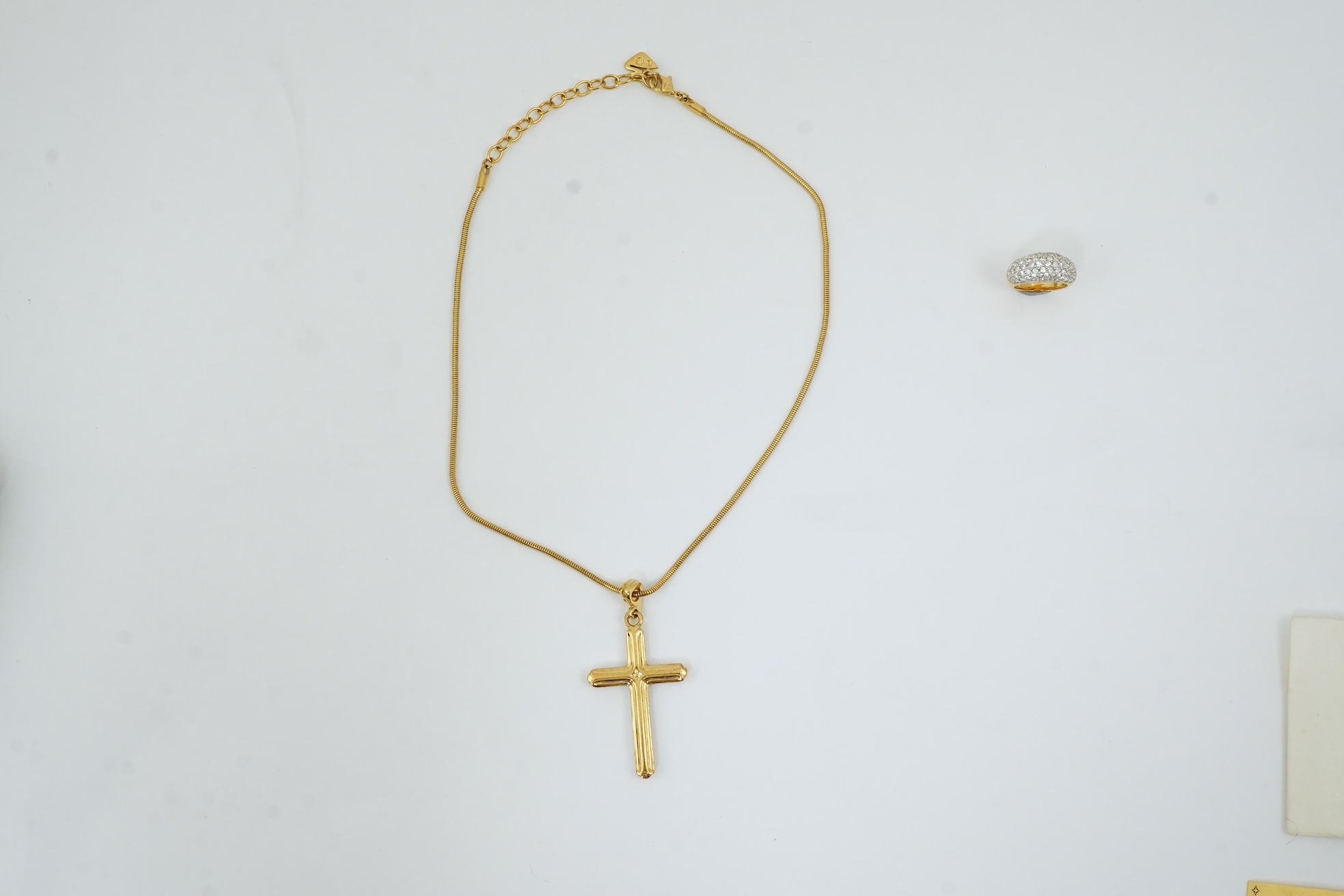 A Swarovski vintage cross necklace and ring.